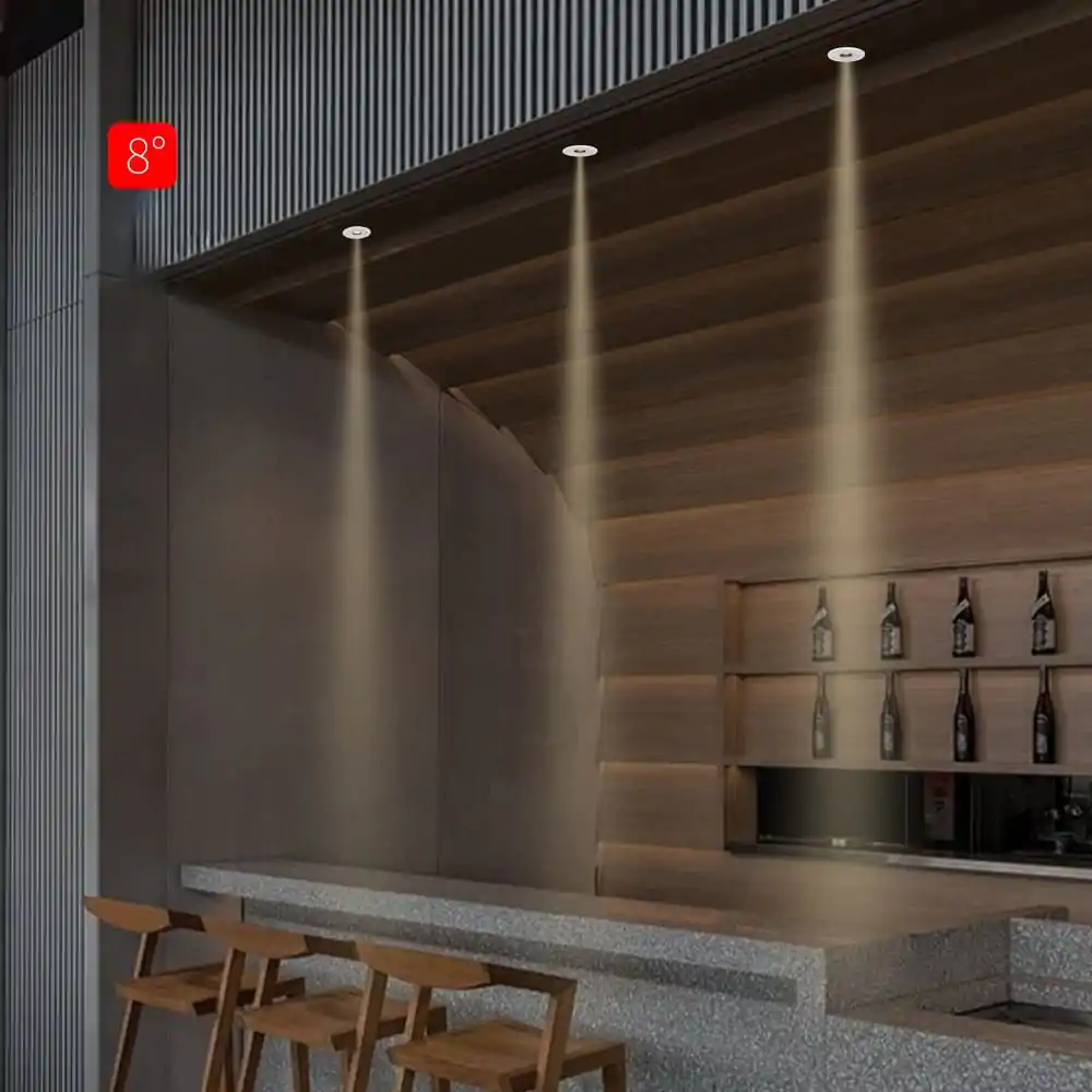 8° ceiling track lighting illuminating a modern bar area in a commercial space.